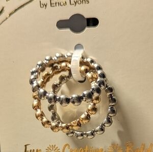 Erica brand. Set of three rings in silver and gold hues.NWT.
